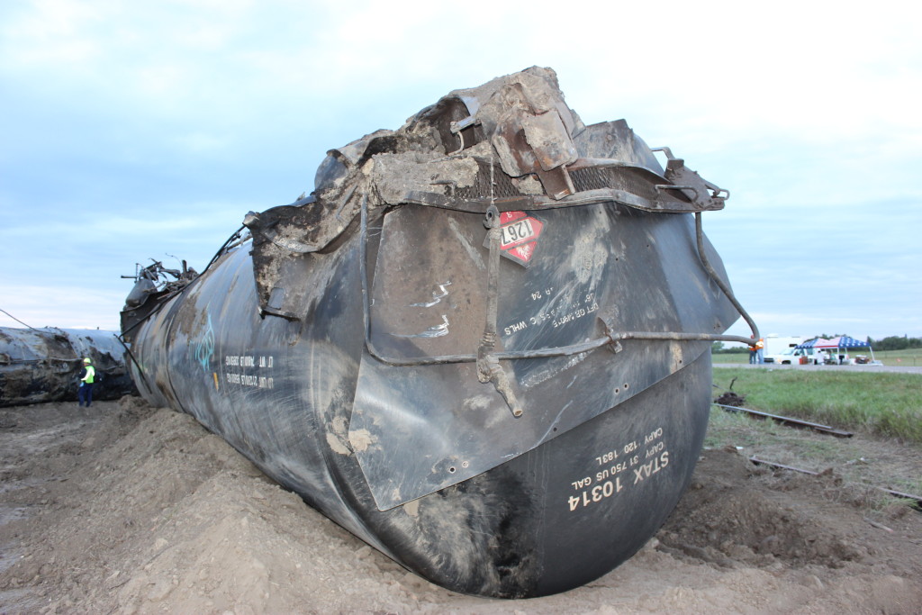 A DOT inspector in the background at the recent tank car derailment in Culbertson, MT. Image courtesy of the DOT.
